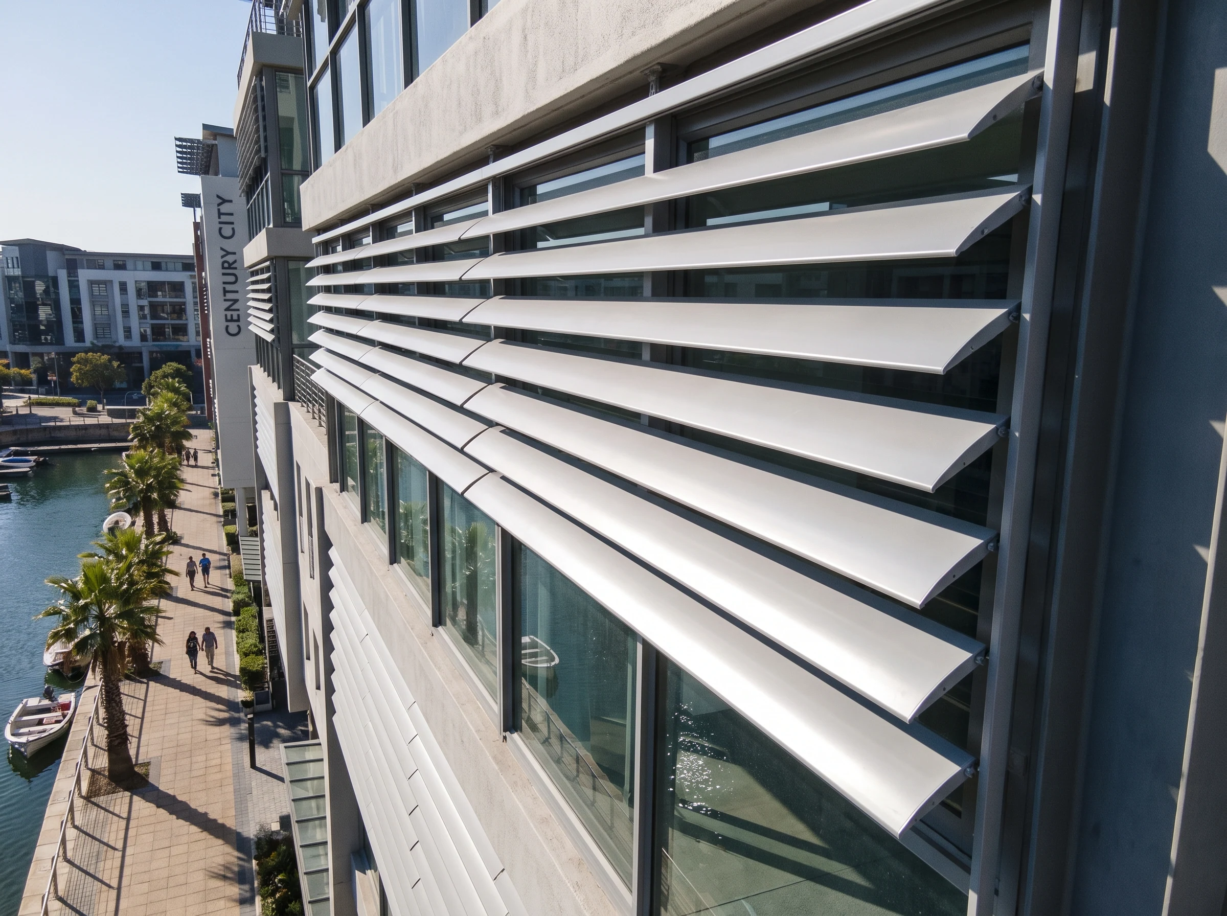 Wide aluminium external venetian blind slats mounted outside a Century City apartment facade above the canal